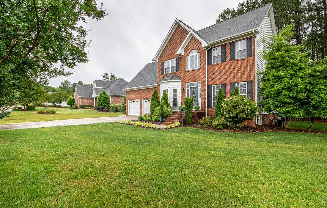 Well-kept residential lawn with trees